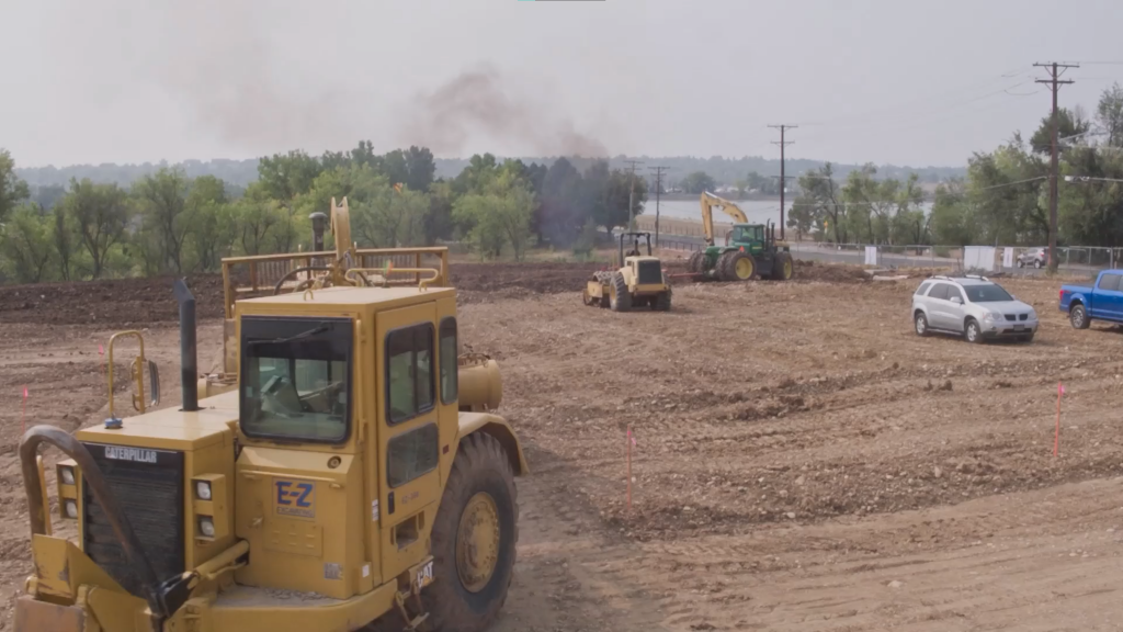 picture of construction equipment in action in a rural neighborhood